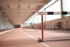Hurdles on Running Track Meta Title: Overcoming Hurdles: Navigating Business Sales Challenges