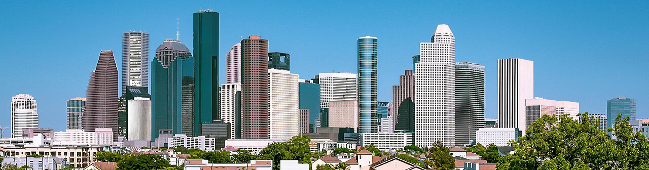 Wide-angle view of the Downtown Houston skyline, representing the massive economic opportunity for those researching how to sell a small business in Houston.